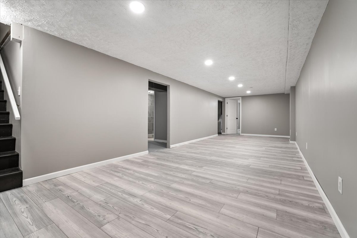 415 Bradley Lane Normal, IL 61761 - Photo 19 of 28 a view of empty room with wooden floor
