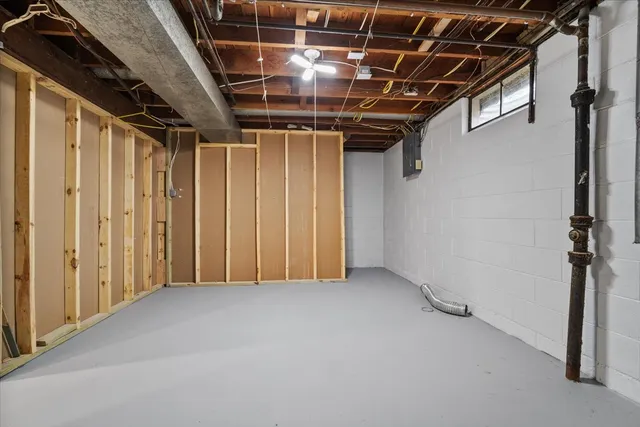 a view of hallway with wooden walls