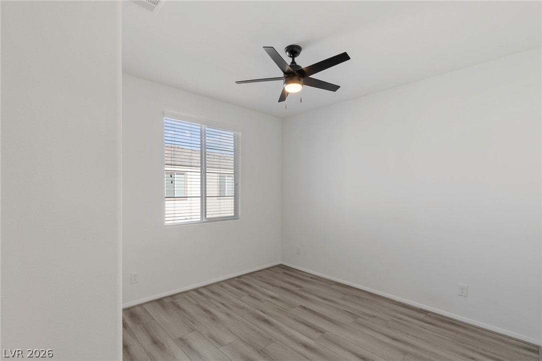 6227 Runestone Street Las Vegas, NV 89113 - Photo 10 of 33 This bright room features a large window, offering ample natural light and a pleasant atmosphere.
