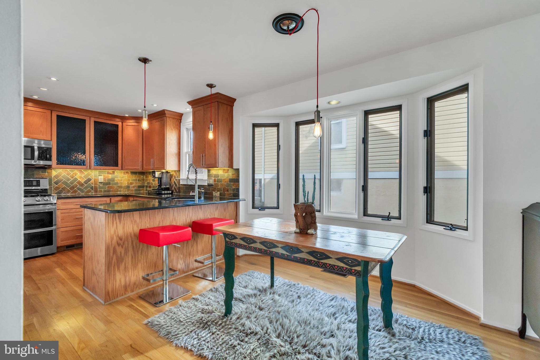 10019 Pratt Place Silver Spring, MD 20910 - Photo 2 of 28 Dining Room
(Bay window, kitchen visible)