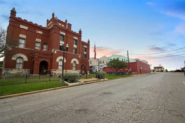 a view of a building with a yard