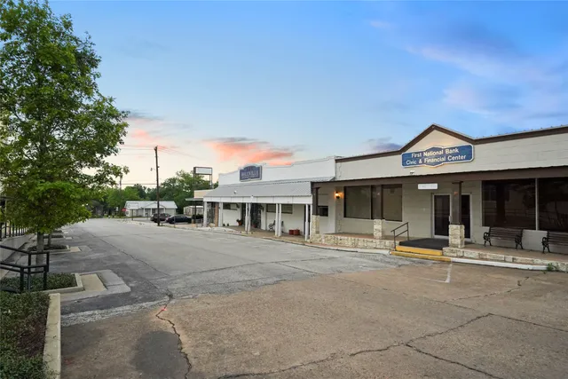 a front view of a building with small garden