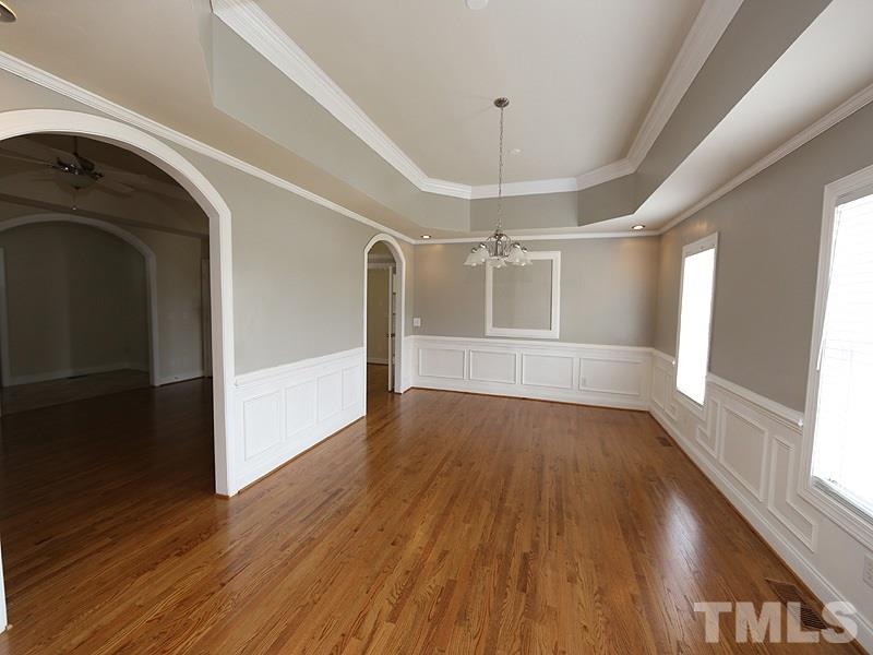 1009 Fieldgrass Place Raleigh, NC 27603 - Photo 2 of 12 a view of empty room with wooden floor