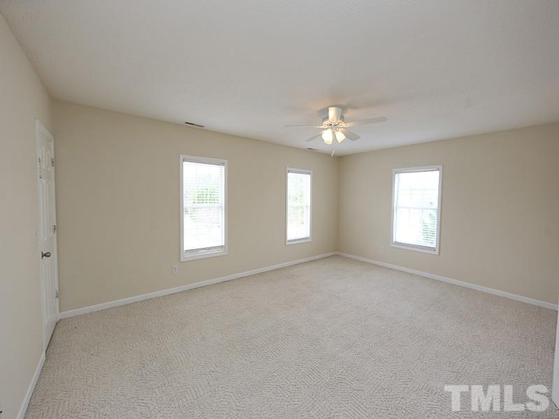 1009 Fieldgrass Place Raleigh, NC 27603 - Photo 8 of 12 a view of an empty room with a window