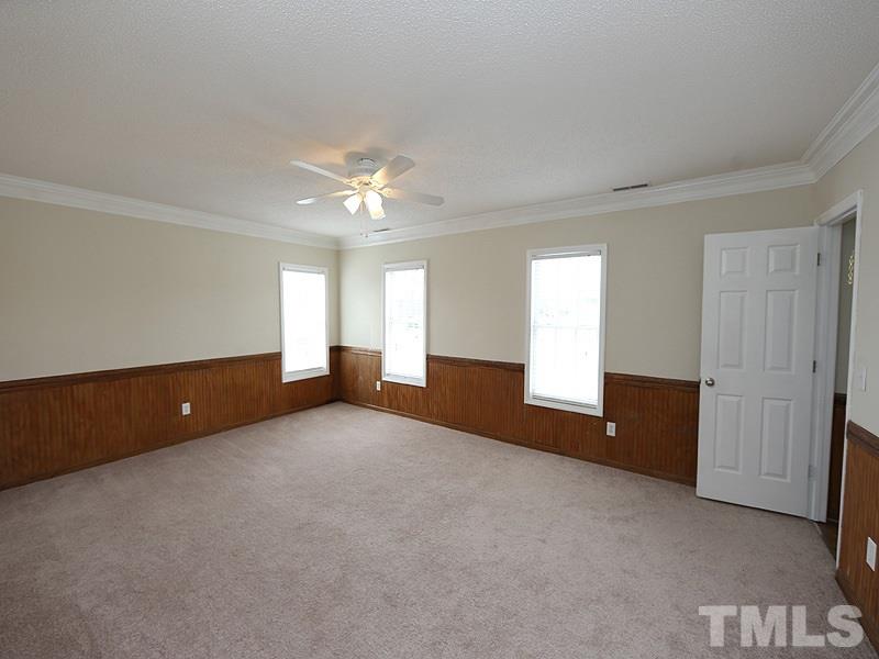 1009 Fieldgrass Place Raleigh, NC 27603 - Photo 9 of 12 a view of an empty room with a window