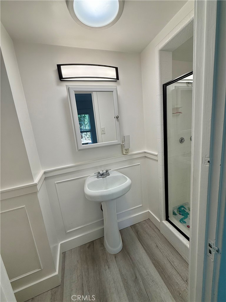 6226 Washington Whittier, CA 90601 - Photo 15 of 21 a bathroom with a sink a toilet and mirror