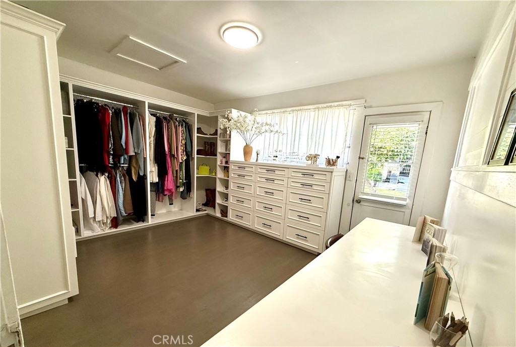 6226 Washington Whittier, CA 90601 - Photo 19 of 21 a view of walk in closet with clothes and shoes