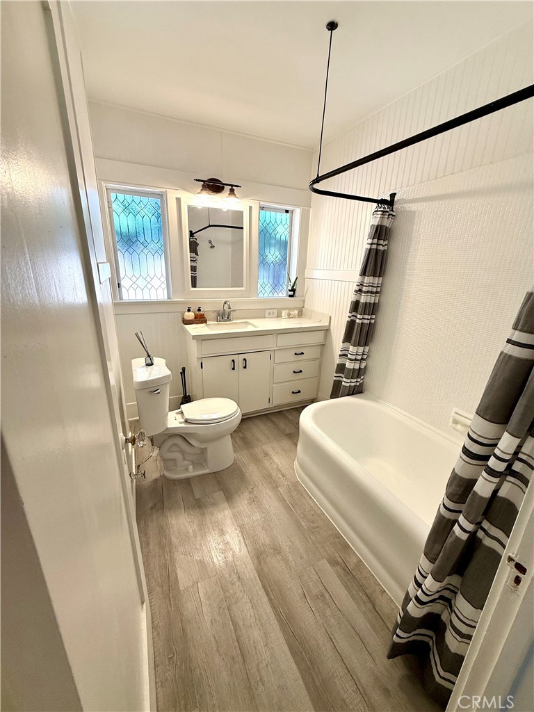 6226 Washington Whittier, CA 90601 - Photo 10 of 21 a bathroom with a sink a toilet a window and shower