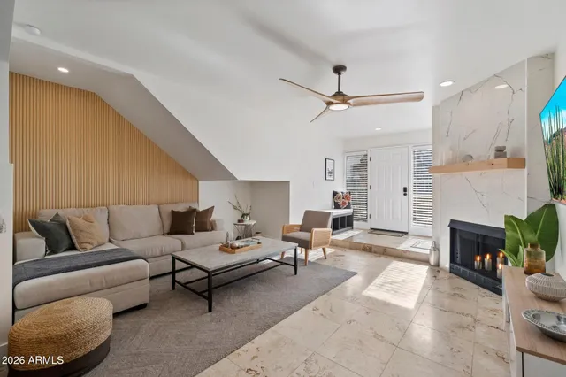 a living room with furniture a fireplace