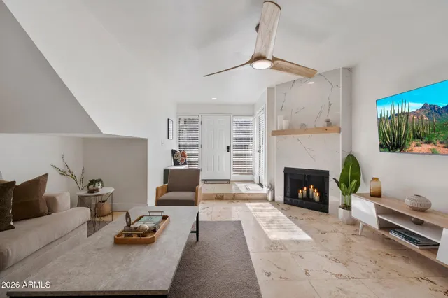 a kitchen with stainless steel appliances granite countertop a sink stove microwave and refrigerator