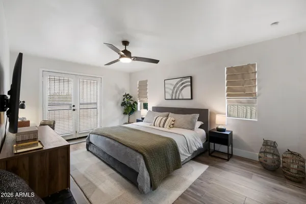 a bedroom with furniture and a window