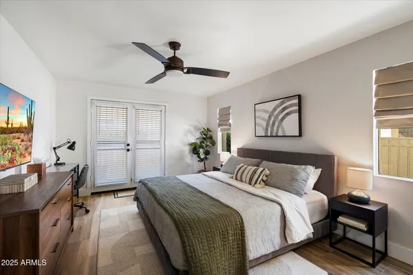 a bathroom with a toilet a sink a mirror and vanity