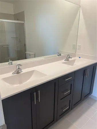 a bathroom with a sink and a toilet