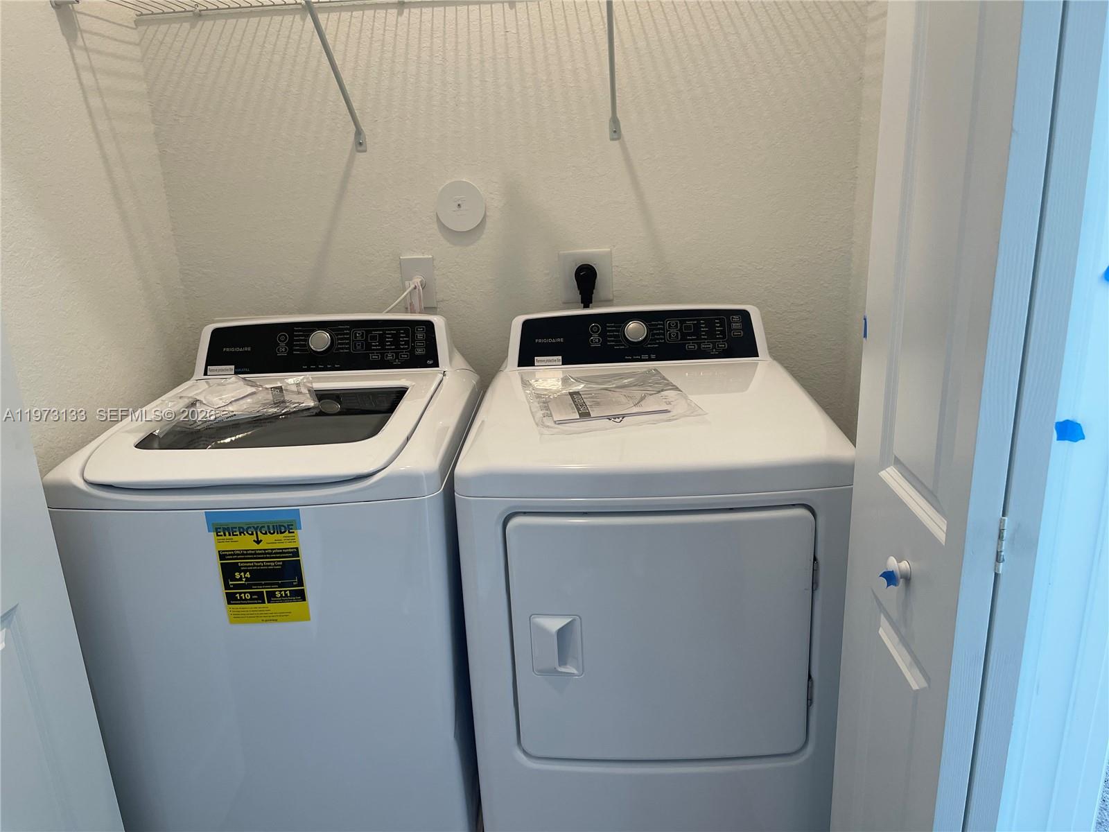 20564 Northeast 5th Place Miami, FL 33179 - Photo 14 of 38 a utility room with dryer and washer