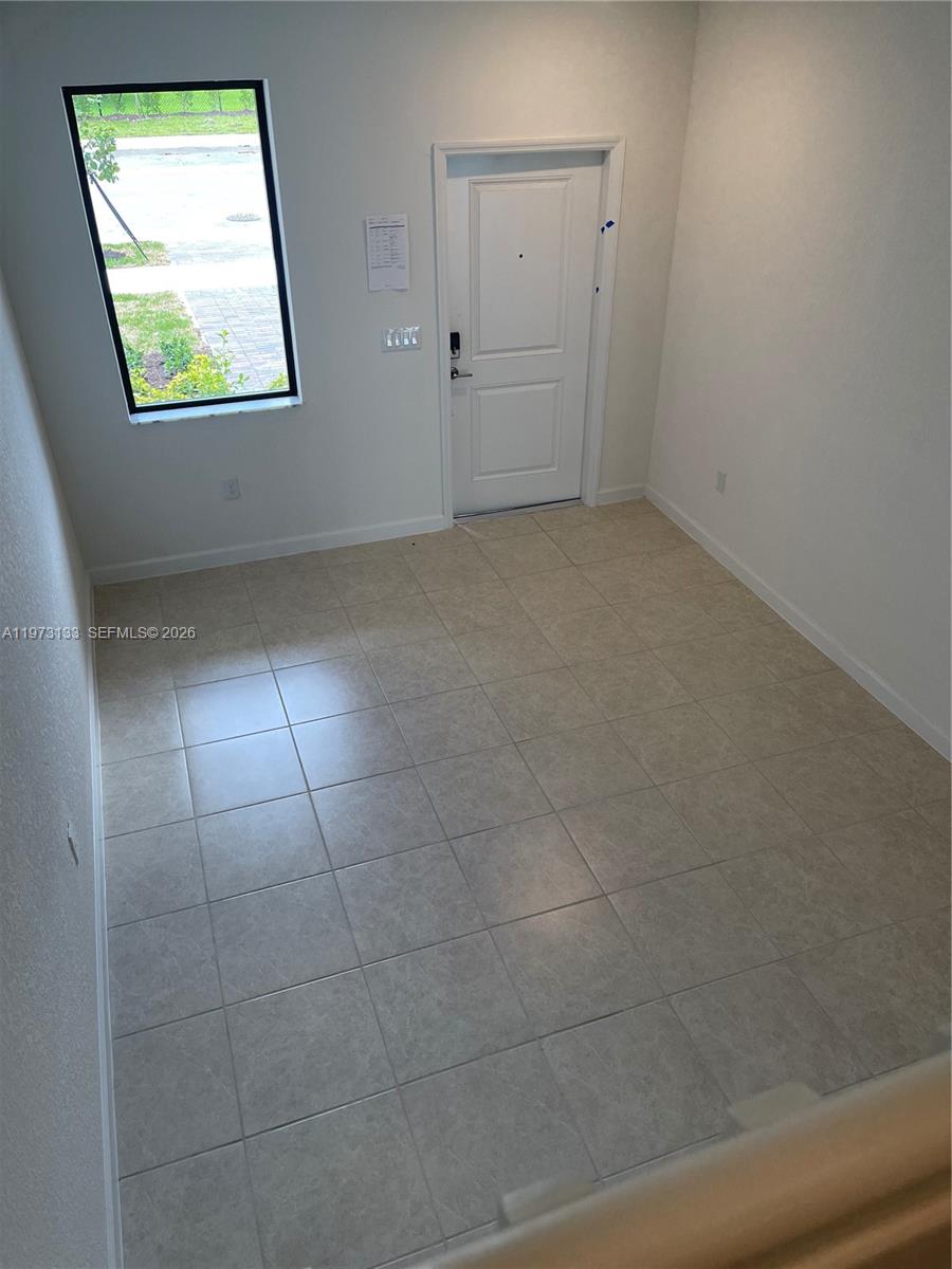 20564 Northeast 5th Place Miami, FL 33179 - Photo 15 of 38 an empty room with window