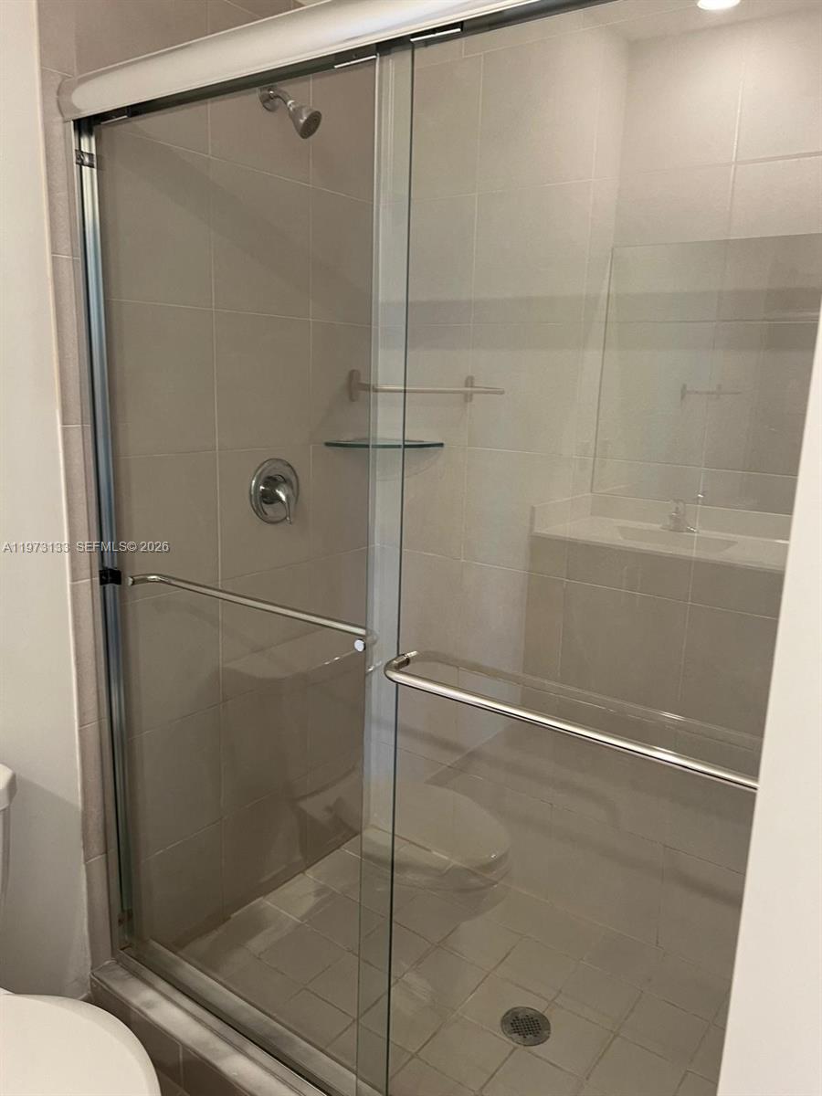 20564 Northeast 5th Place Miami, FL 33179 - Photo 21 of 38 a bathroom with a shower