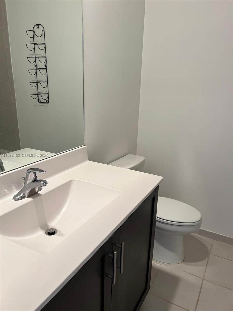 20564 Northeast 5th Place Miami, FL 33179 - Photo 25 of 38 a bathroom with a sink and a toilet