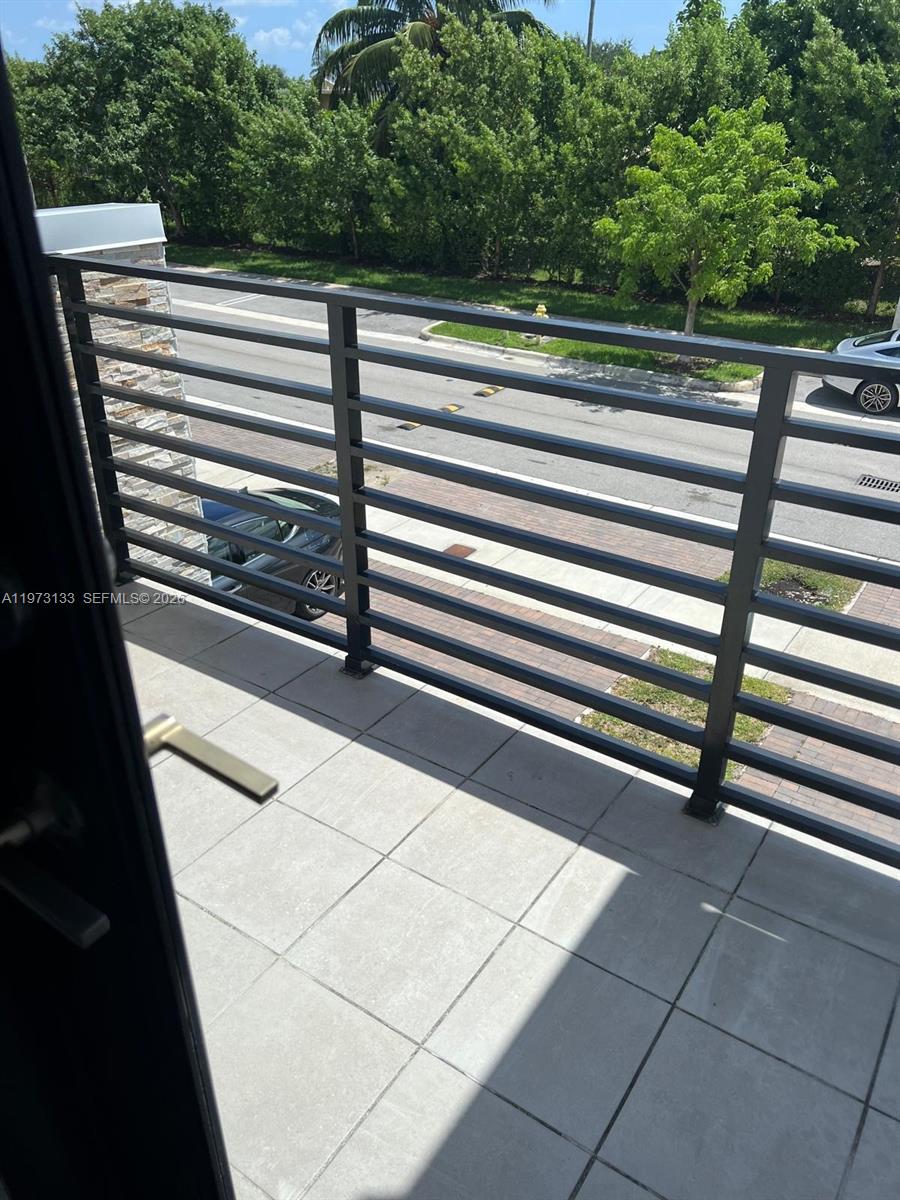20564 Northeast 5th Place Miami, FL 33179 - Photo 30 of 38 a view of a balcony with an outdoor space