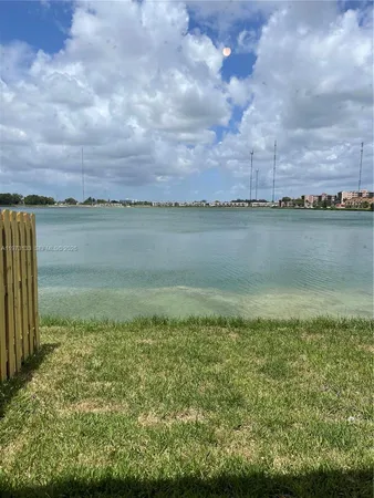 a view of a lake and a yard