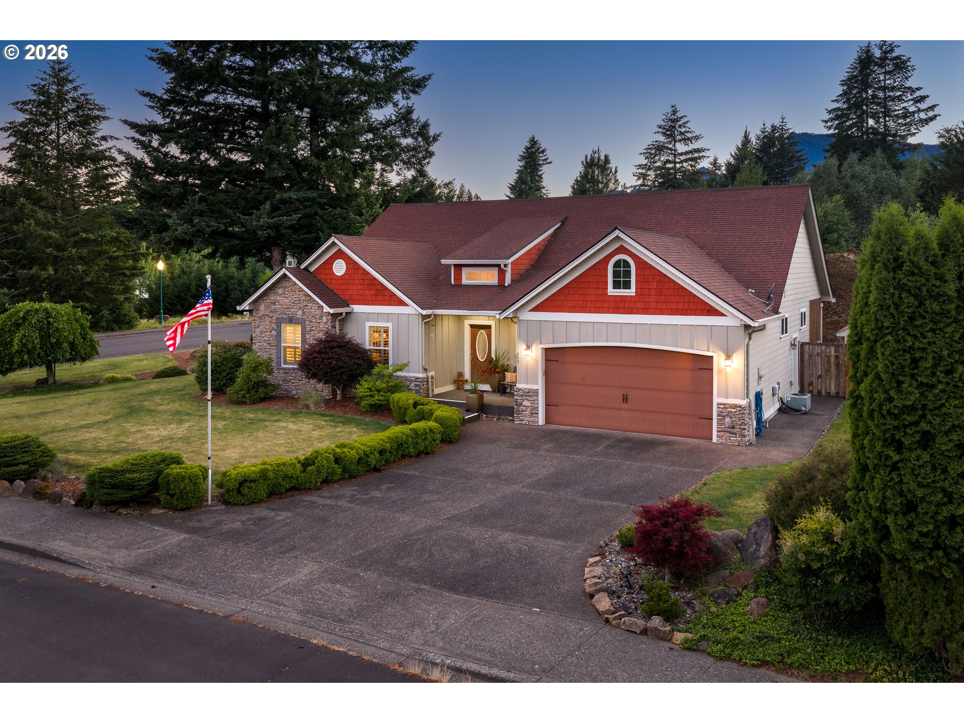 a front view of a house with a yard and garage
