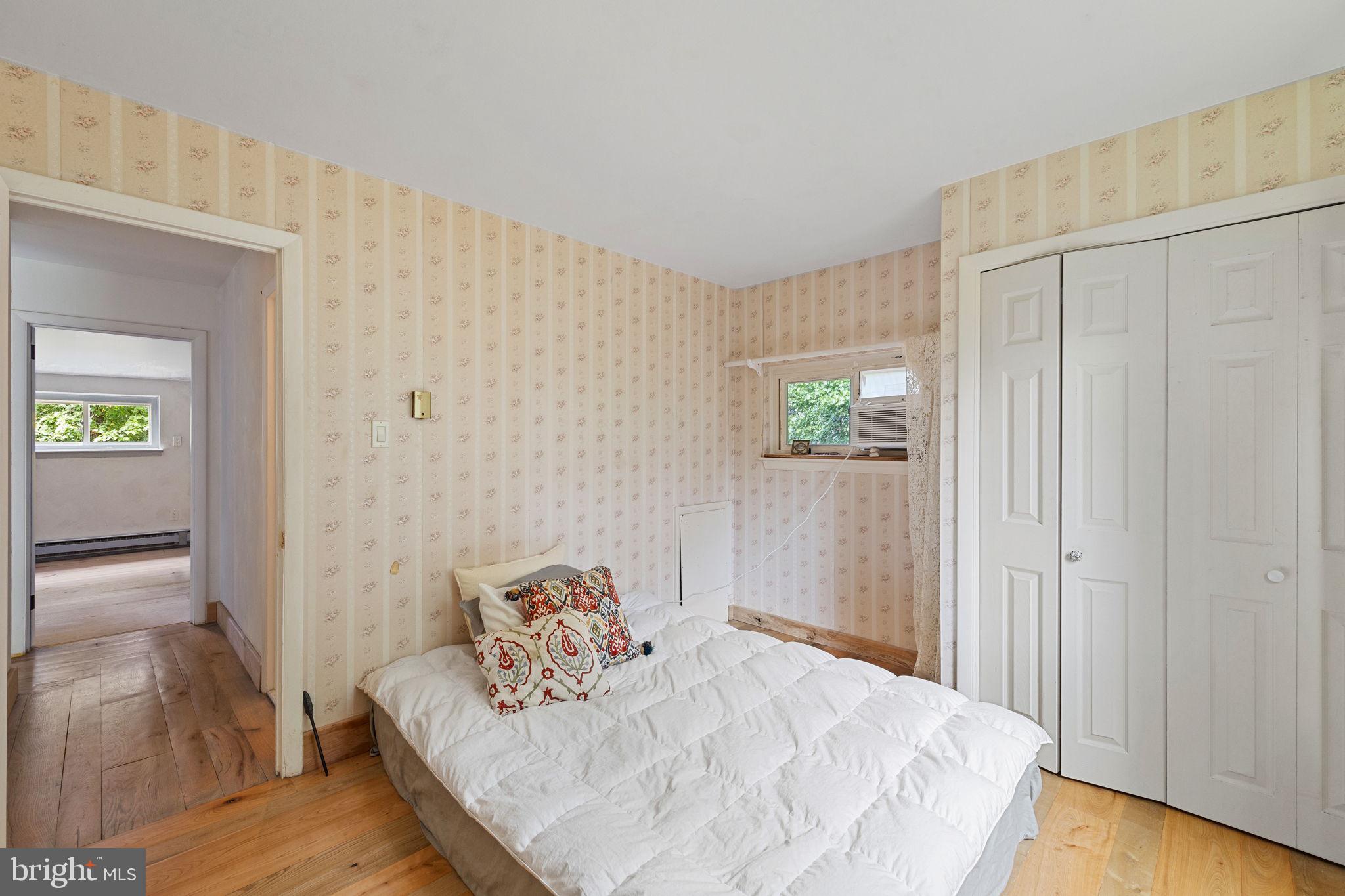 601 Cathcart Road Blue Bell, PA 19422 - Photo 16 of 38 a bedroom with a bed and a table in it