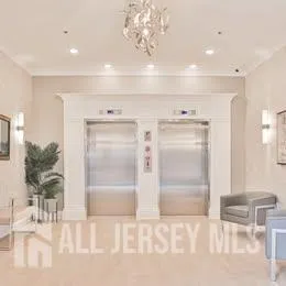 a view of a brick building next to a yard