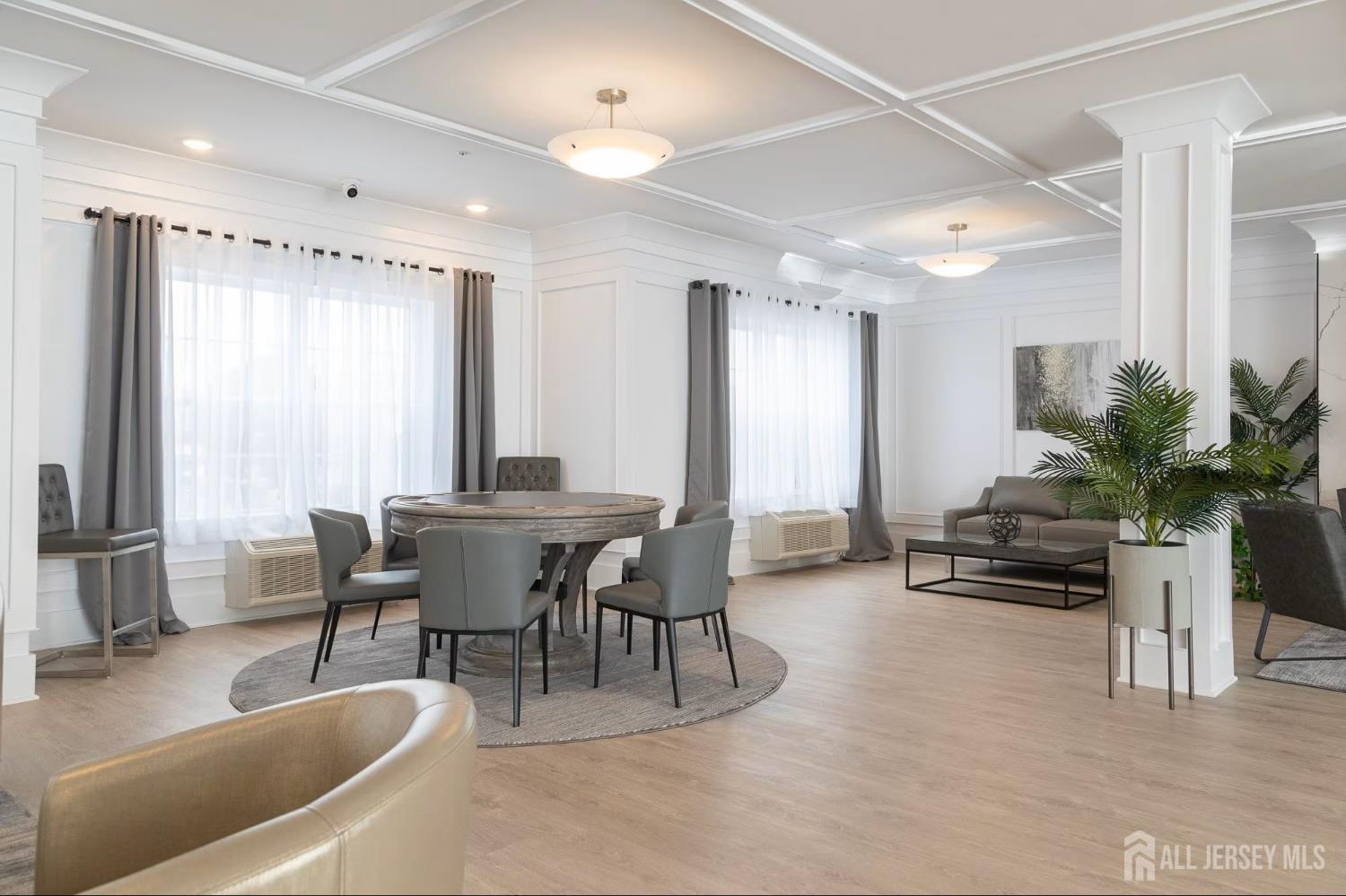 175 Quincy Court, Unit B406 Hopelawn, NJ 08861 - Photo 6 of 12 a dining room with furniture and window