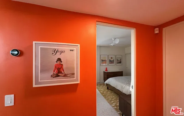 a view of a hallway with a painting on the wall