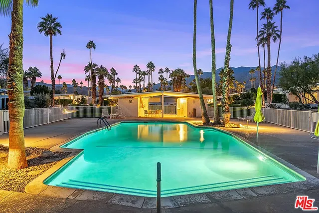 a view of a swimming pool with a lake view