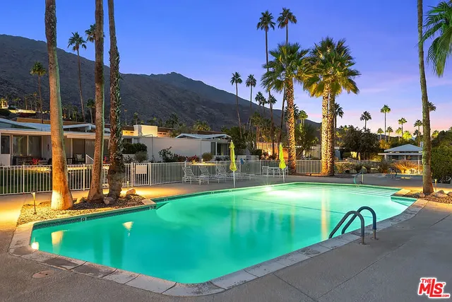 a view of a swimming pool with a lounge chairs
