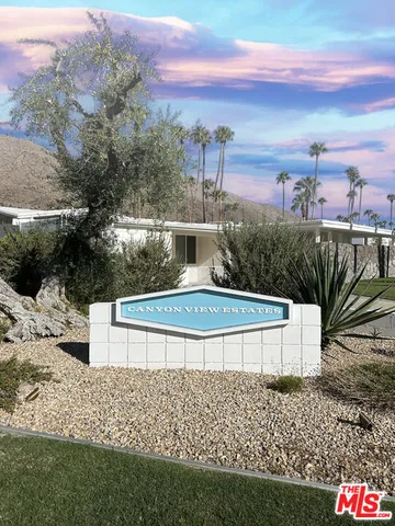 a bedroom with a bed and lamp