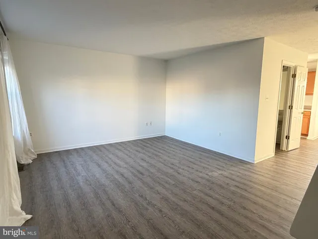 a backyard of a house with yard and outdoor seating