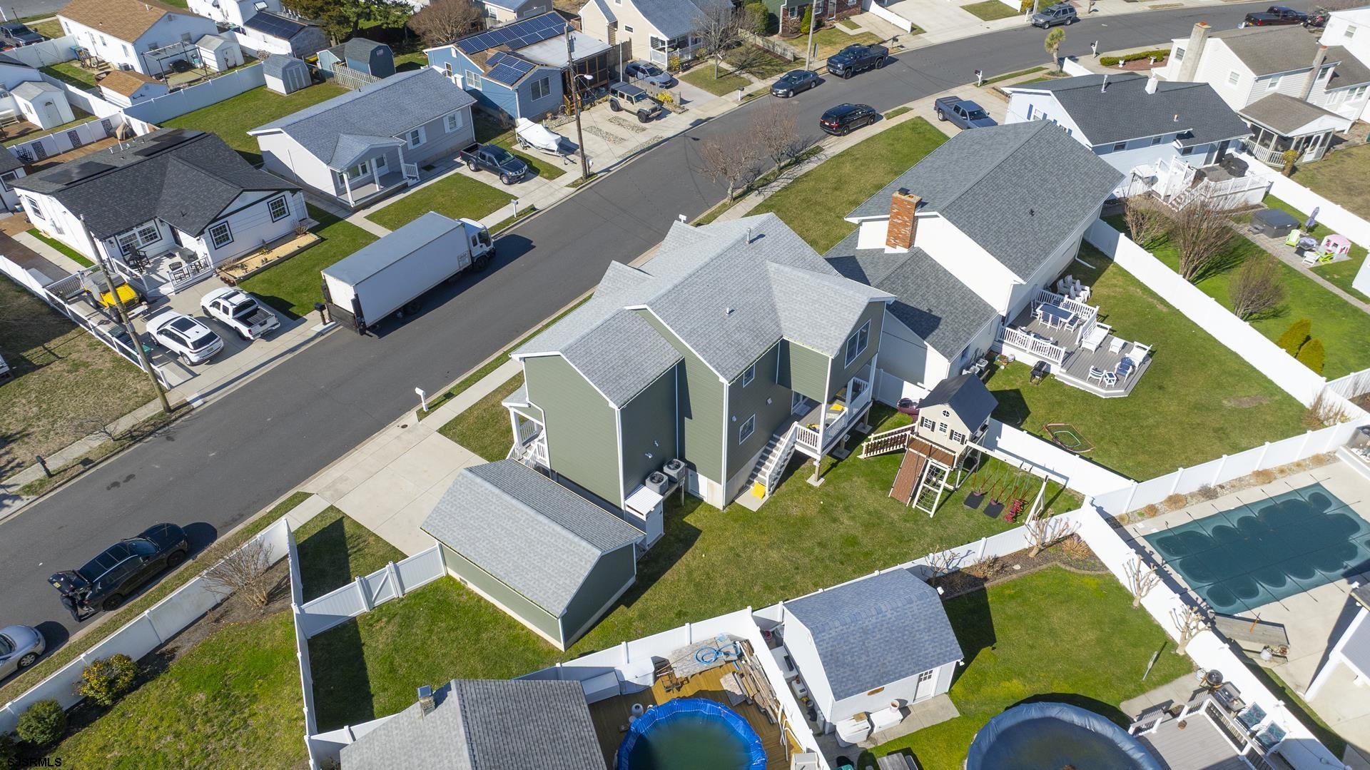 703 Bobby Jones Road Brigantine, NJ 08203 - Photo 32 of 34 an aerial view of a house with a yard and outdoor seating