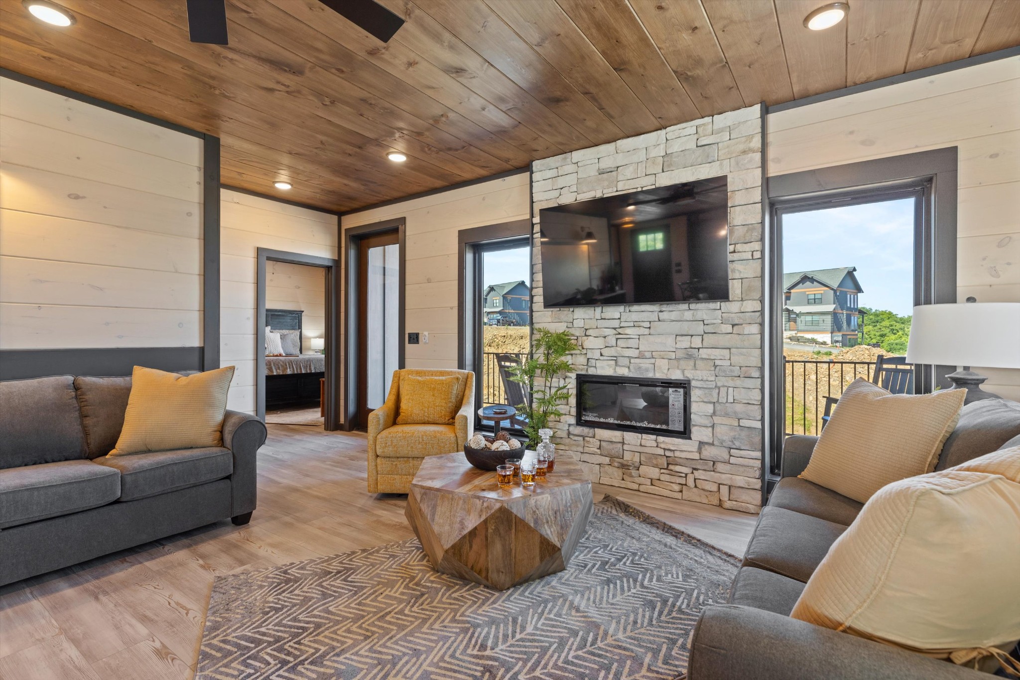 56 R Rambling Crk Way Sevierville, TN 37862 - Photo 15 of 54 a living room with furniture a flat screen tv and a fireplace