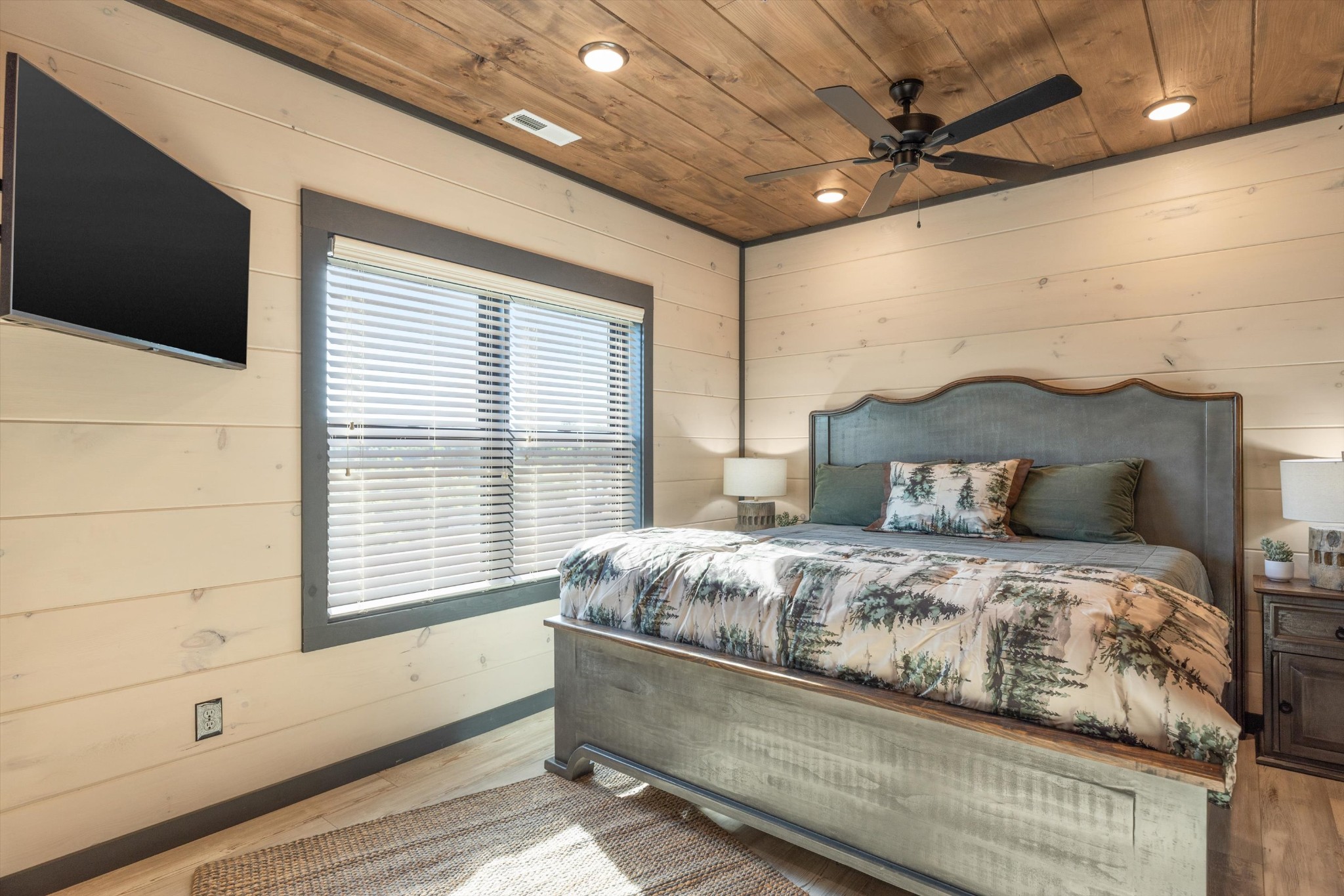 56 R Rambling Crk Way Sevierville, TN 37862 - Photo 47 of 54 a bedroom with a large bed and a flat tv screen on dresser
