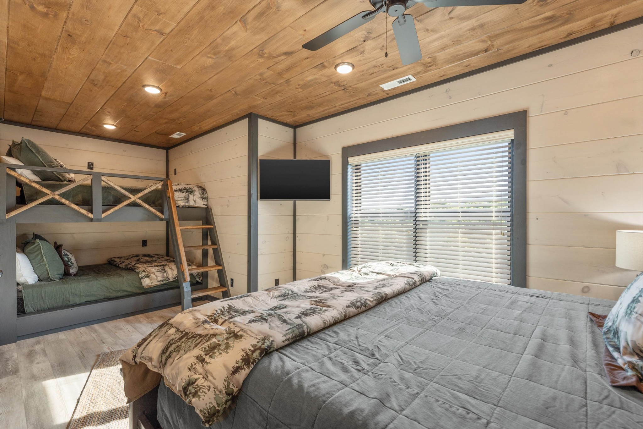 56 R Rambling Crk Way Sevierville, TN 37862 - Photo 48 of 54 a bedroom with a bed and a glass walk in closet