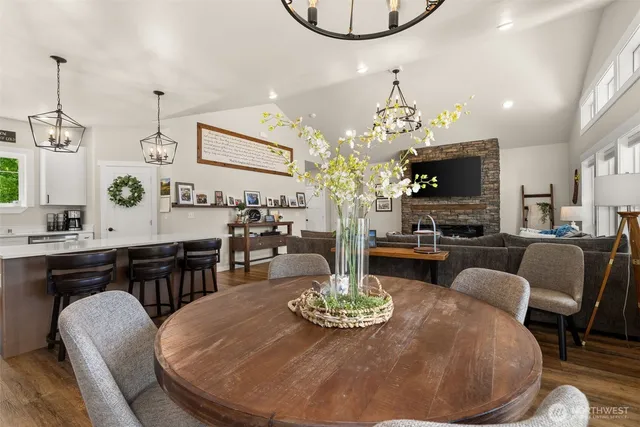 a living room with fireplace furniture and a flat screen tv