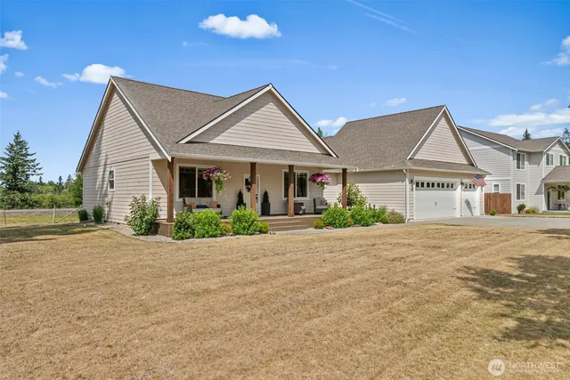 a view of a house next to a yard
