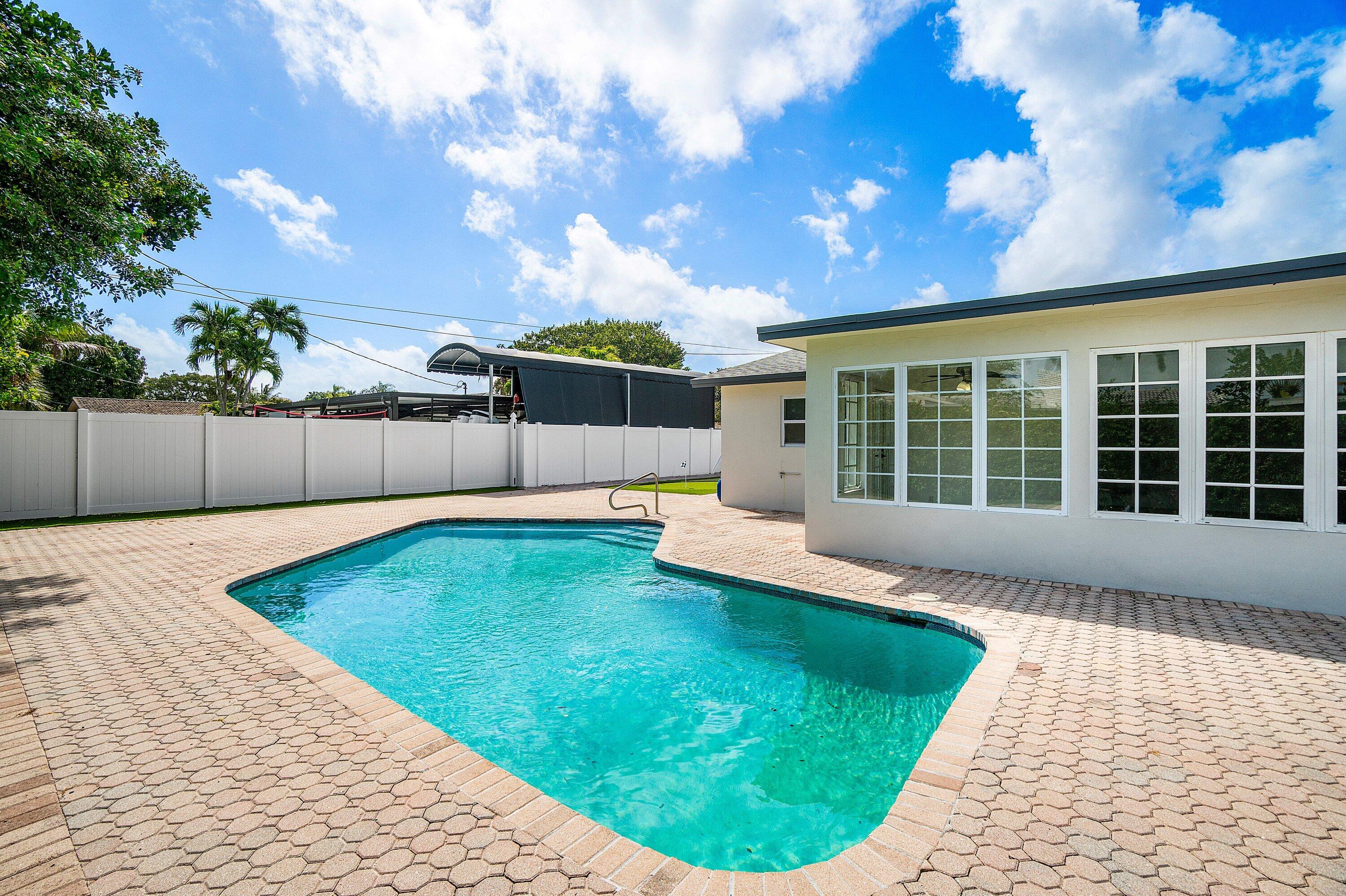 1531 Northwest 4th Street Boca Raton, FL 33486 - Photo 29 of 34 a view of a backyard with a swimming pool