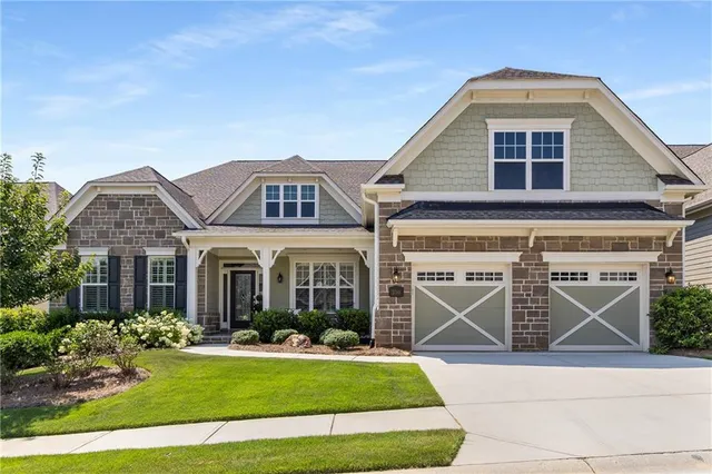 a front view of a house with yard