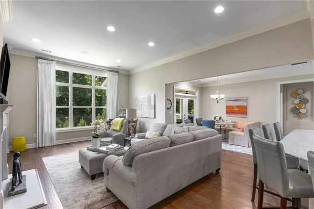 a kitchen with stainless steel appliances granite countertop a sink refrigerator and cabinets