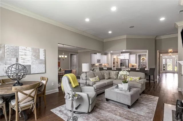 a kitchen with a granite countertop sink and refrigerator