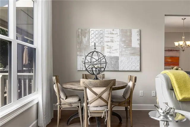 a kitchen with a refrigerator a sink dishwasher a stove and white cabinets with wooden floor