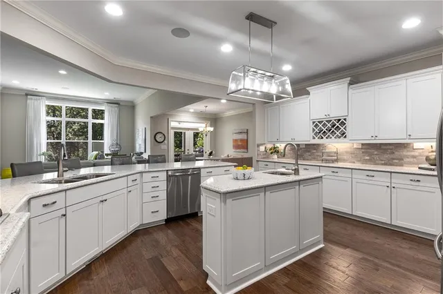 a bedroom with a bed wooden floor and a ceiling fan