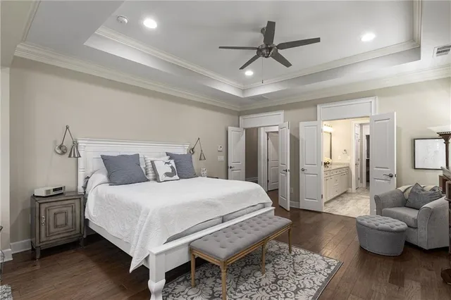 a bedroom with a bed and a chair