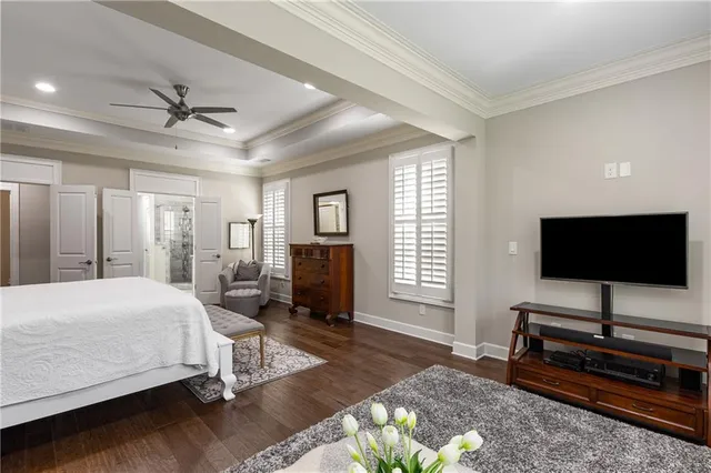a view of a patio with a table chairs and a potted plant