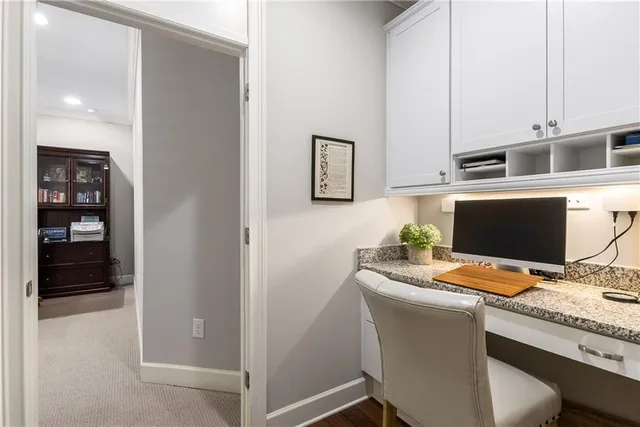 a living room with fireplace furniture and a large window