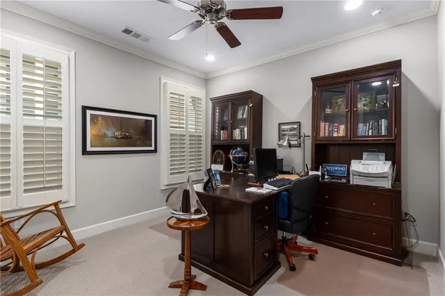 a living room with fireplace furniture and a large window