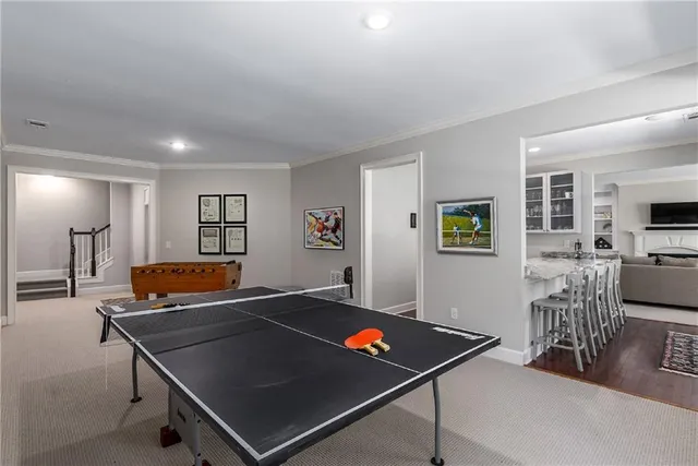 a view of a porch with wooden floor and outdoor seating