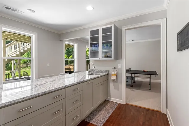 an aerial view of a residential houses with outdoor space and street view